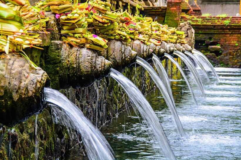 Bali: Rice terrace, Waterfall, and water Temple Day Tour - Kanto Lampo’s rocks and spraying water