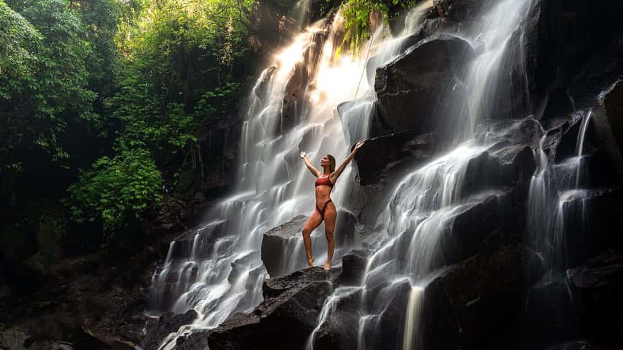 Bali/Ubud: Kanto Lampo Waterfall, Monkey Forest & Swing Tour - Kanto Lampo Waterfall: wet rocks and good photo angles