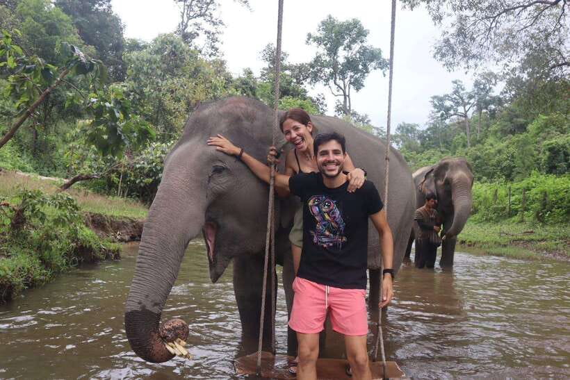Chiang Mai: Elephant Sanctuary & Waterfall Group Tour - Cooling off in the river