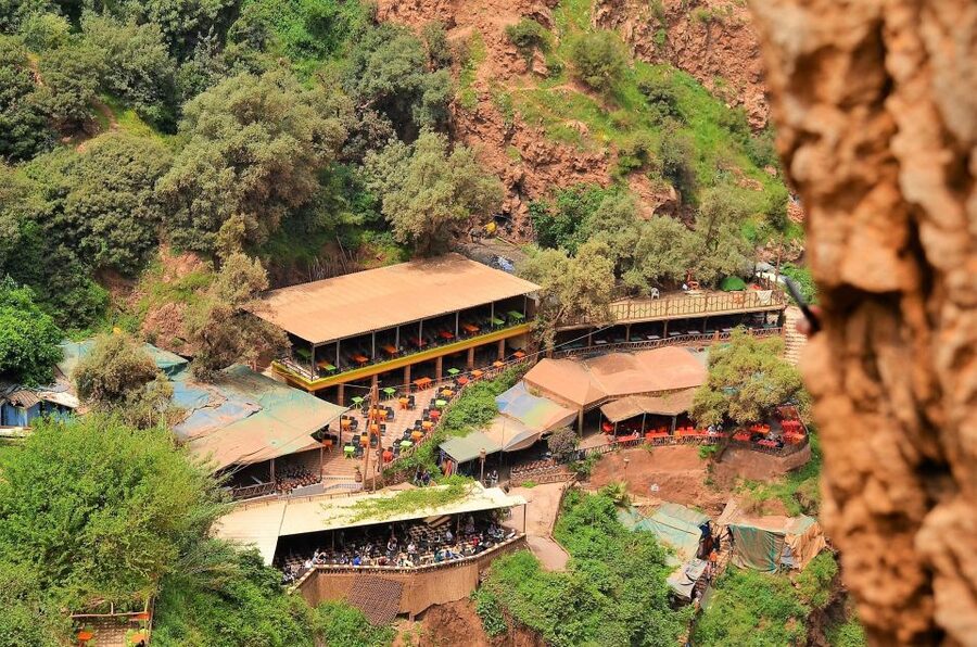 Day Trip To Ouzoud Waterfalls & Boat Ride From Marrakech - The wooden boat near the falling water