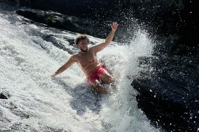 El Yunque Waterslide and Waterfall Tour with Food and Photos - Timing, meeting point, and cancellation rules