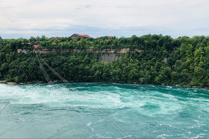 Epic Niagara Falls Private Tour w/ Tower, Journey & Boat Cruise - Floral Clock: a quick Parkway photo stop