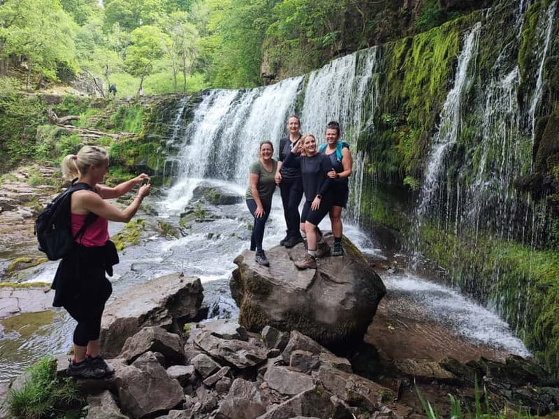 From Cardiff: Guided Hike to 8 Waterfalls in Brecon Beacons - Walking behind the waterfalls