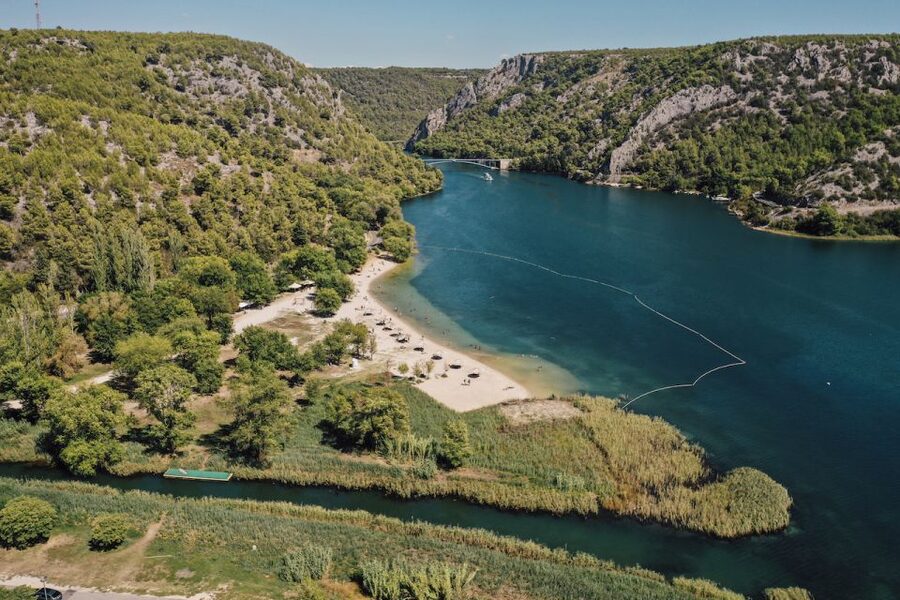 From Split: Krka Waterfalls Tour with Boat Cruise & Swimming - The panoramic boat ride toward Skradin