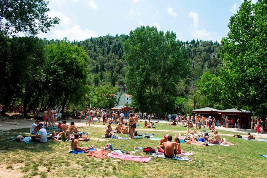 From Split: Krka Waterfalls Tour with Boat Ride & Swimming - Walking the wooden paths around Skradinski Buk