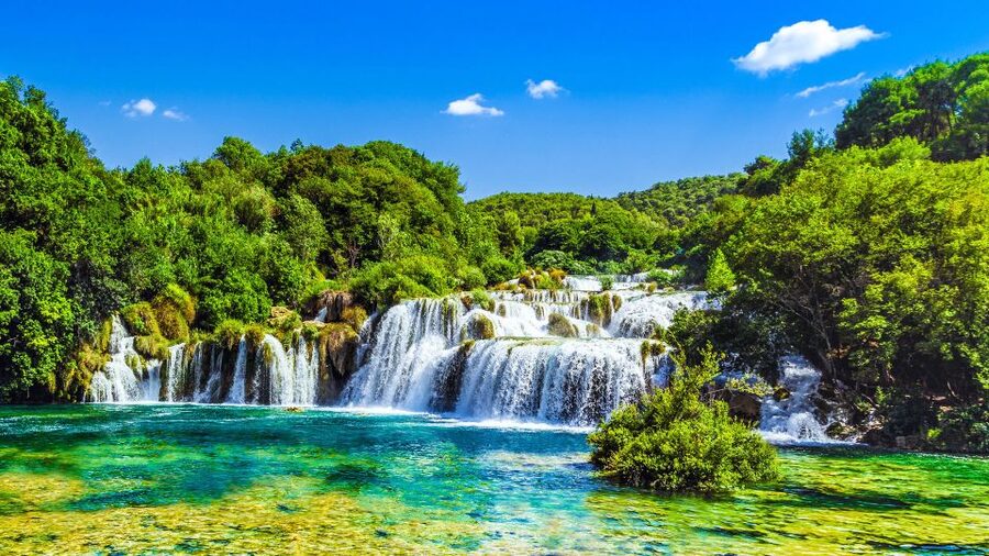 From Split & Trogir: Krka Waterfalls Day Tour with Boat Ride - Old stone houses and a working watermill
