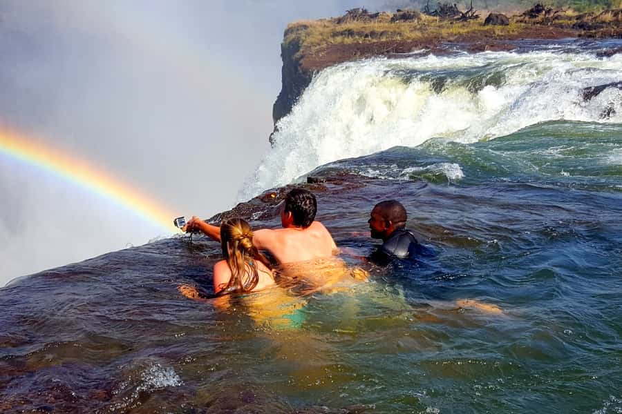 From Victoria Falls: Livingstone Island Tour & Devils Pool - Sitting above Victoria Falls on Livingstone Island
