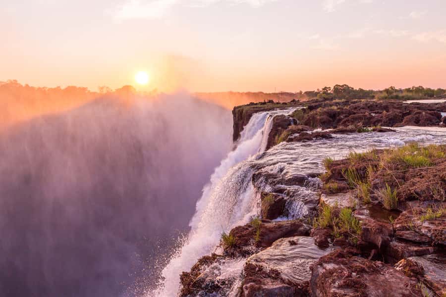 From Victoria Falls: Livingstone Island Tour & Devils Pool - The boat ride and the first waterfall views