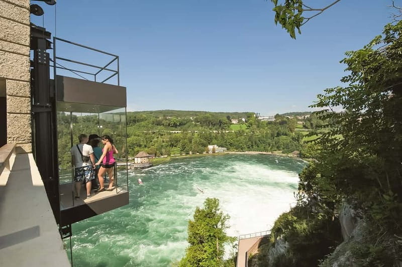 From Zurich: Rhine Falls Coach Tour with Entry Tickets - The optional boat ride into the spray