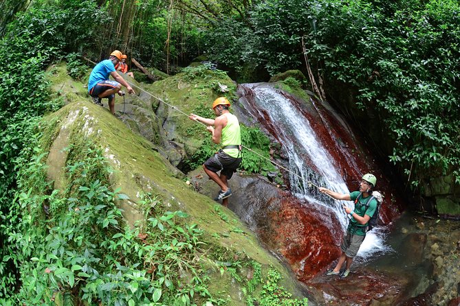 Full-Day Zipline and Waterfall Rappelling Adventure Near San Juan - The uphill river hike is the real test