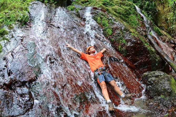 Full-Day Zipline and Waterfall Rappelling Adventure Near San Juan - Getting fitted for the river and rappel