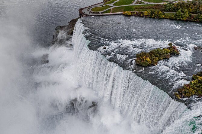 Niagara Falls Day Tour from Toronto with Boat Cruise and Lunch - Clifton Hill and the first look at the Falls