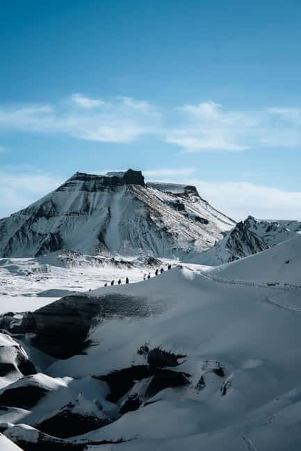 Reykjavik: Katla Ice Cave & South Coast Waterfalls Tour - Walking into the Katla Ice Cave