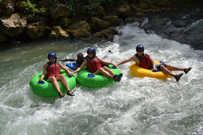 River Rapids Waterfalls Tubing and Beach Adventure with Transport - Bamboo shade, a rope swing, and a pause in the river