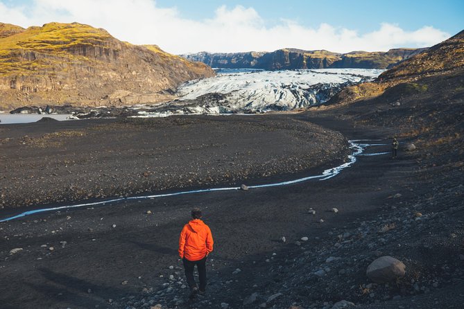 South Coast Day Tour Black Sand Beach & Waterfalls from Reykjavik - Solheimajokull Glacier at the route’s edge