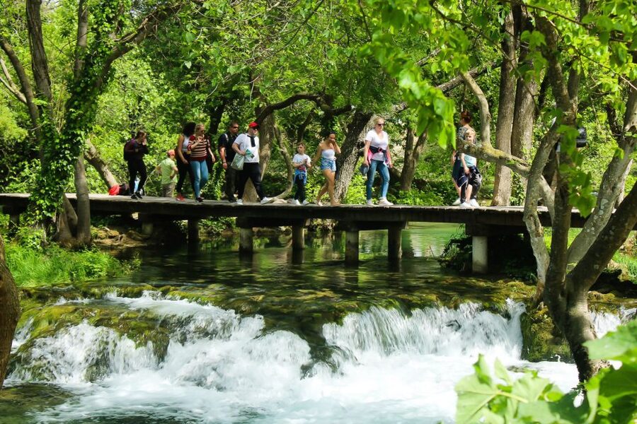Split: Krka Waterfalls With Boat Cruise, Wine and Olive Oil - Skradinski buk and the wooden walkway