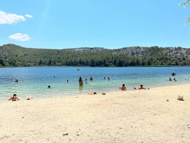 Zadar: Krka Waterfalls Tour, Boat Cruise & Swimming - Taking the river boat to Skradinski buk